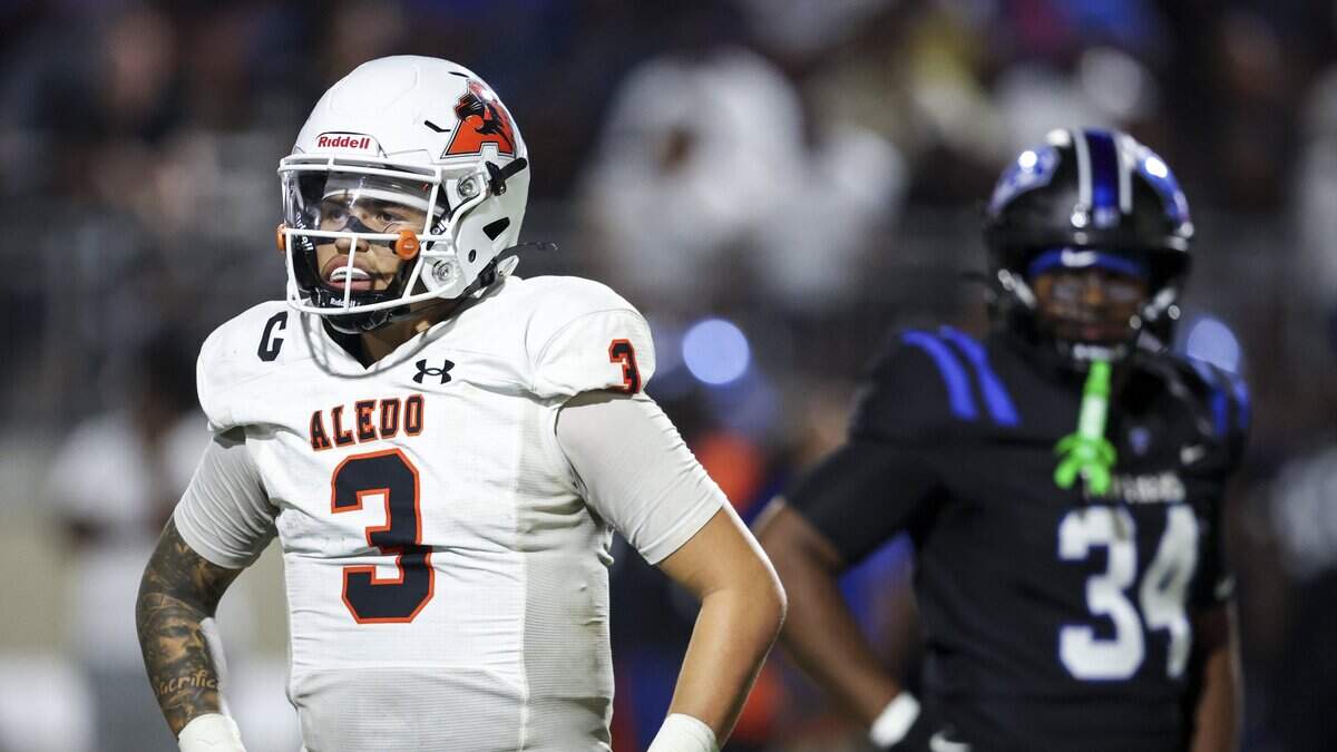Aledo quarterback Tre Williams (3) between plays during the second half of the game against North Crowley on Friday, Aug. 28, 2026 at Crowley ISD Stadium in Fort Worth.
